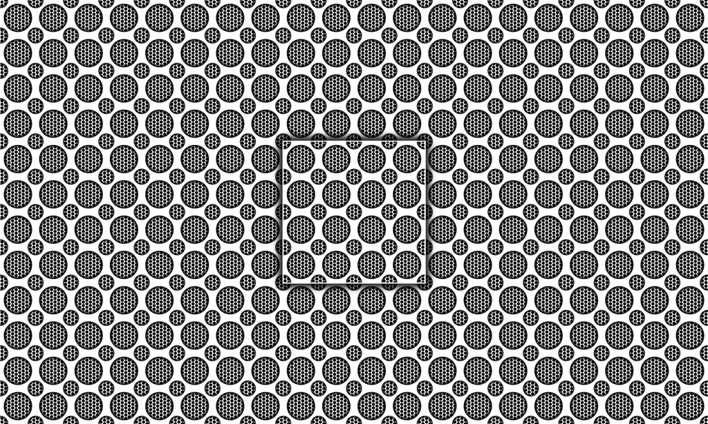 A metal grate plate with circles punched out