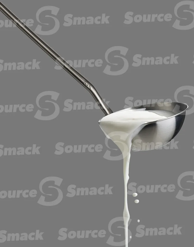 A ladle pouring milk clipped as a transparent image