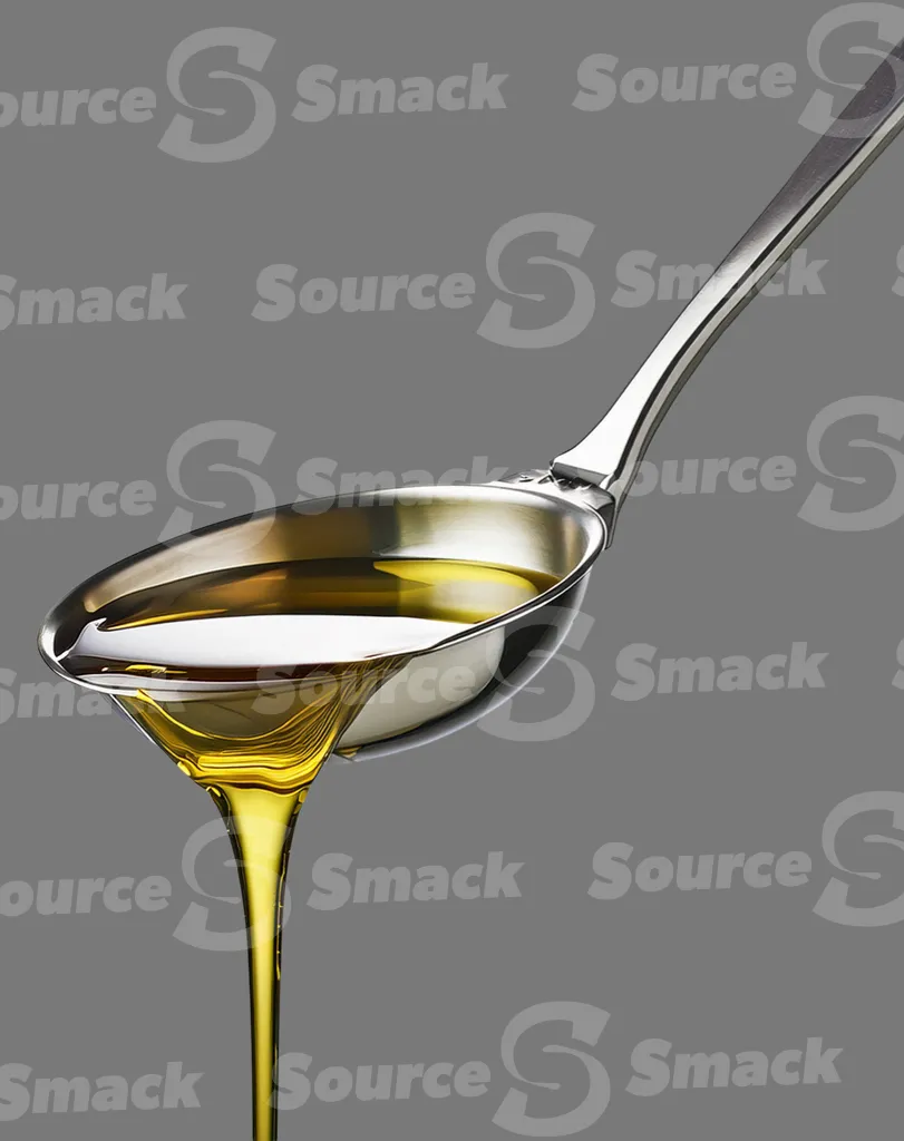 A ladle pouring oil clipped as a transparent image