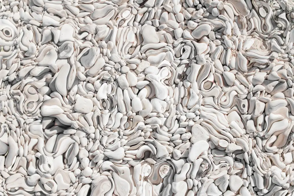 White paint globs in a liquid connected form