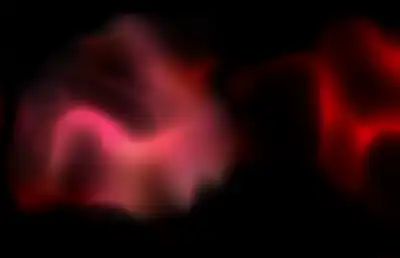 An atmospheric red gas floating in darkness