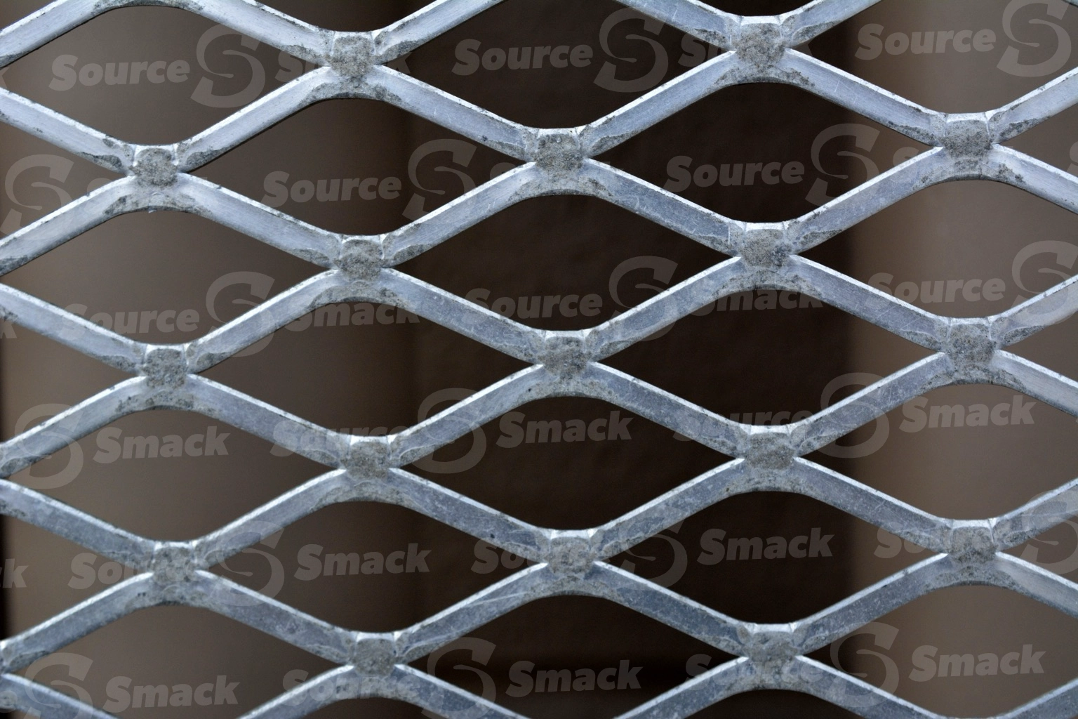 Closeup of metal weaved grating
