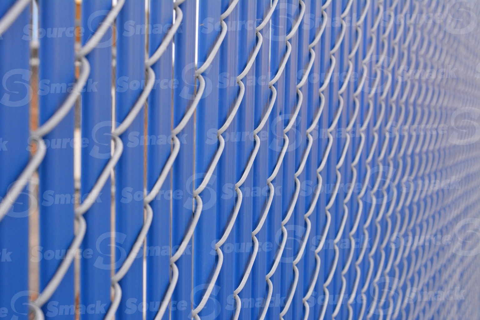 Metal fence with plastic slats