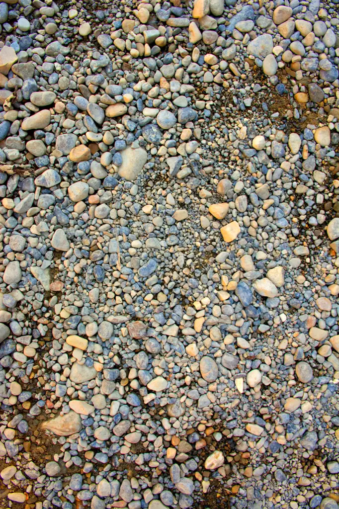 Pebbles and rocks within a riverbed