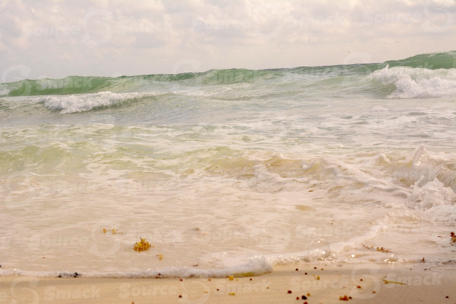 Ocean waves crashing on a beach in Mexico
