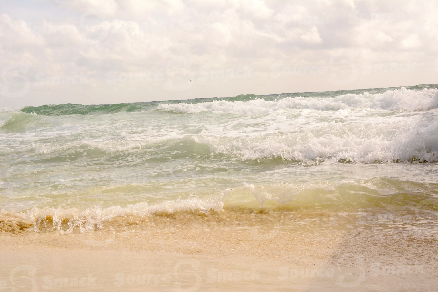Ocean waves crashing on a beach in Mexico