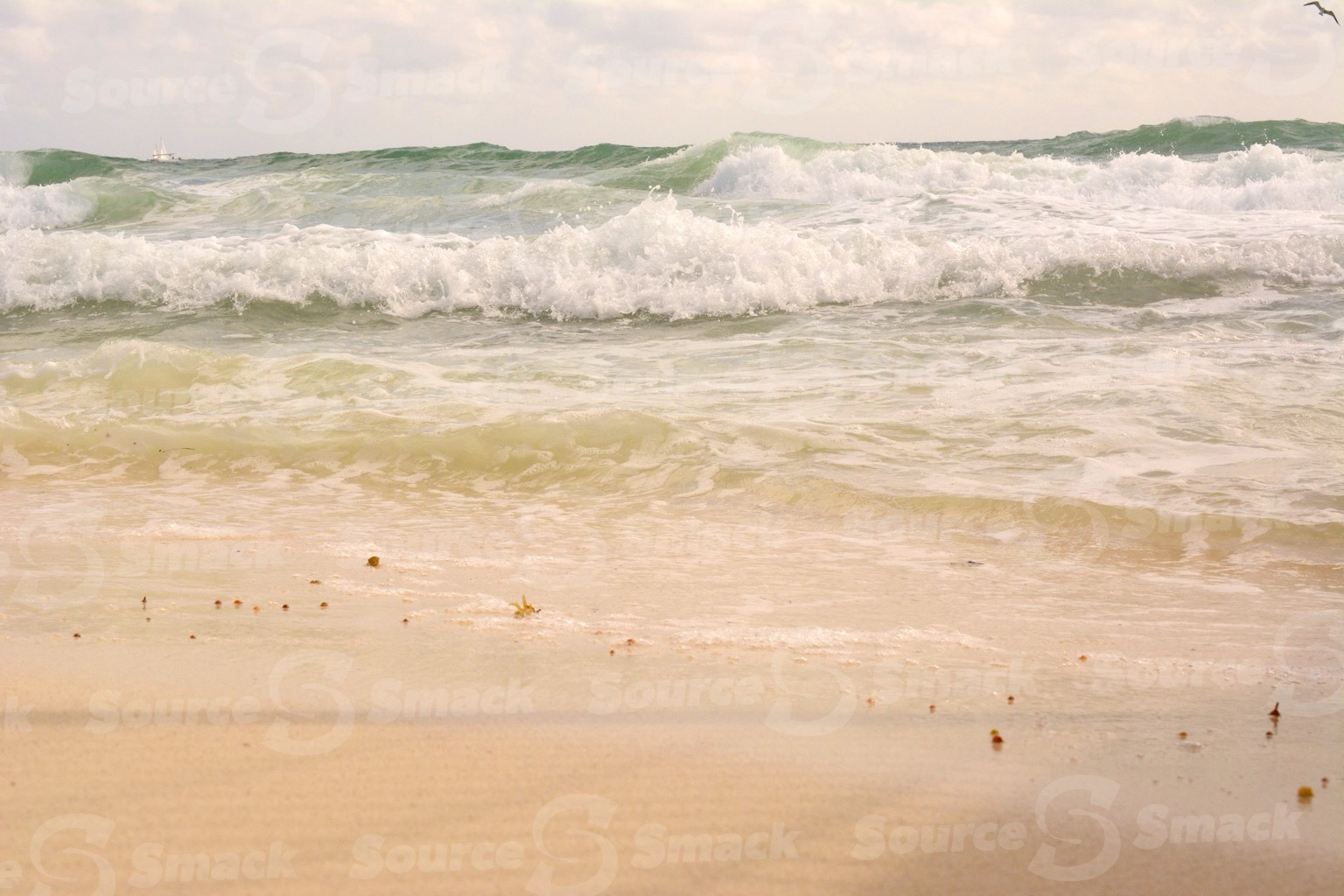 Ocean waves crashing on a beach in Mexico