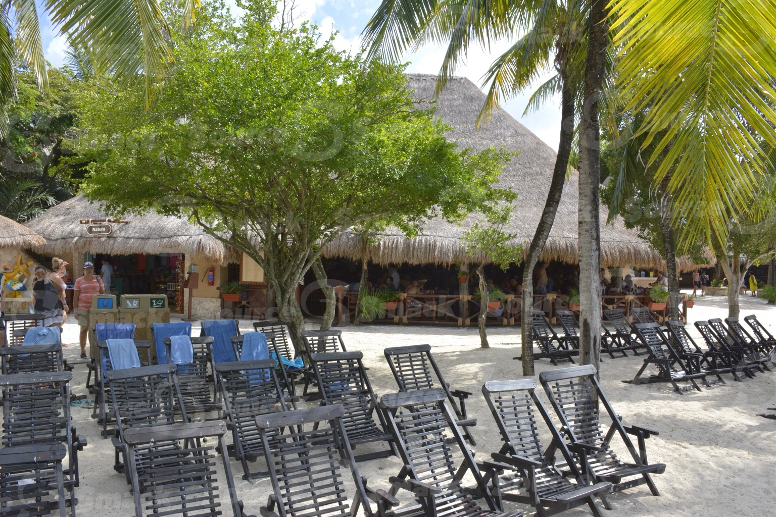 Xel-Ha Park beach with lawn chairs in Mexico